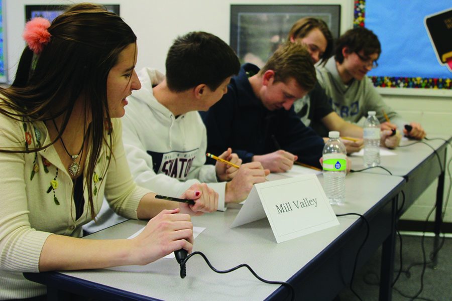 The quiz bowl team briefly discusses a math question at a meet at Maranatha Christian Academy. The team swept the competition and won the meet on Wednesday, Jan. 18.