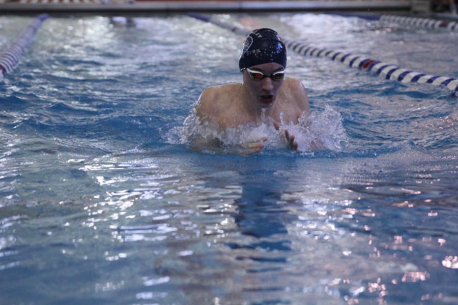 Junior Ethan Forristal swims a breaststroke on Saturday, Feb. 17.