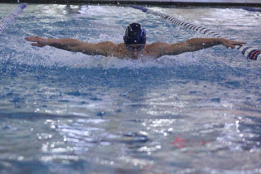 On Saturday, Feb. 17, senior Carter Lawson swims the Butterfly portion of the 200 medley relay.