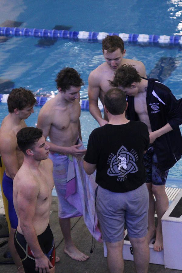 After placing eighth in the 200 freestyle relay, senior Carter Lawson, juniors Chris Sprenger and Ethan Forristal and sophomore Colby Beggs receive their medal before stepping onto the podium on Saturday, Feb. 17.