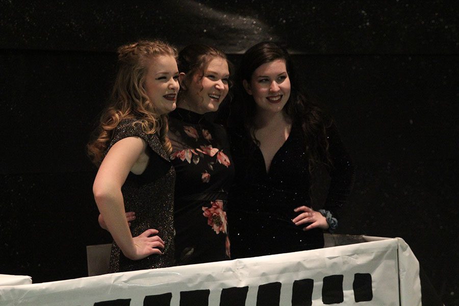 Seniors Julia Feuerborn, Lauryn Hurley, and Kathryn McNaughton pose together at the spaceship photo booth.