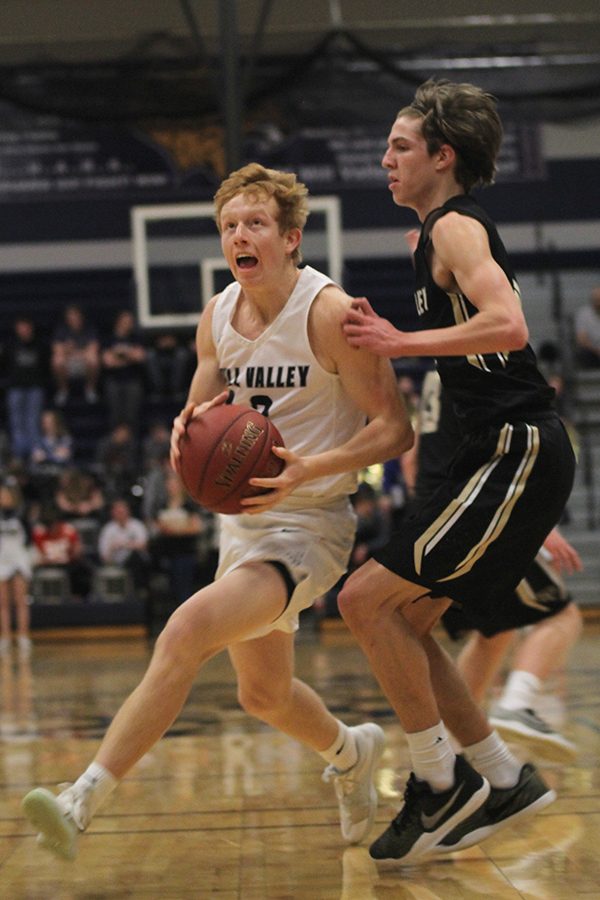 Running into the lane, senior Sammy Rebeck shoots a layup.