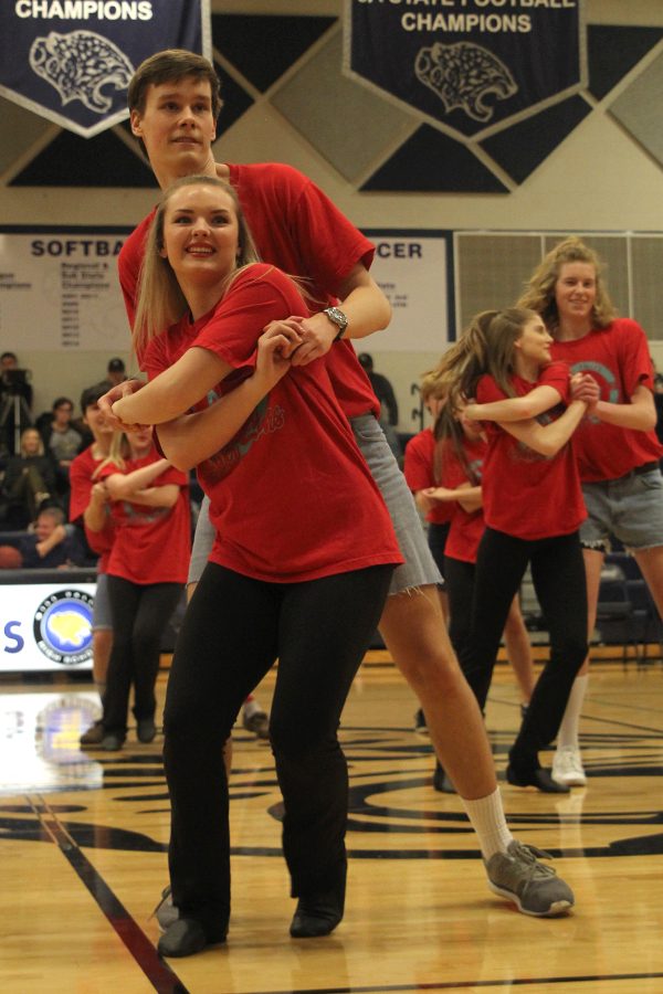 During the Silver Stars and Silver Studs performance, seniors Artur Chlopecki and Emmy Bidnick dance together. 