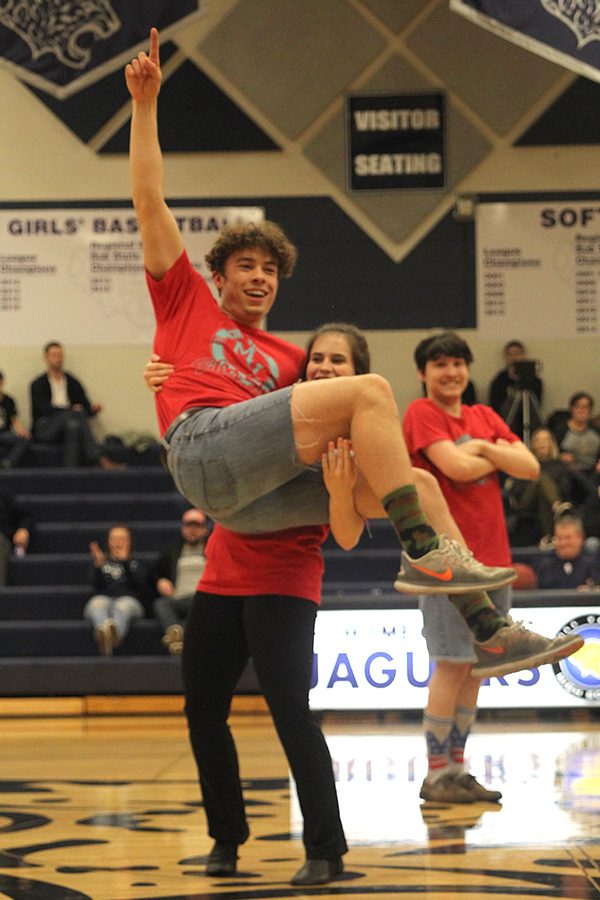 To end their dance, senior Luke Guilford jumps into the arms of junior Olivia Augustine.