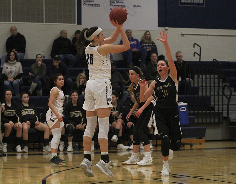 Lining up her shot, junior Trinity Knapp prepares to release the ball on Friday, Feb. 23.