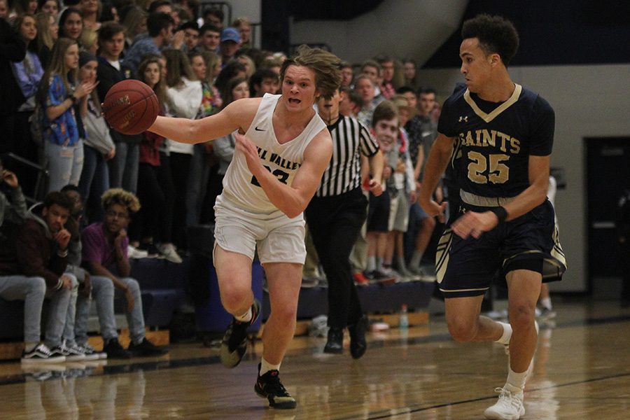 During the first quarter, senior Cooper Kaifes races down the court on Friday, Feb. 9. The team was victorious against Aquinas 72-60.