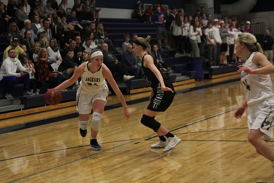 Dribbling past a BVSouthwest defender, senior Evan Zars prepares to pass the ball to senior Adde Hinkle.