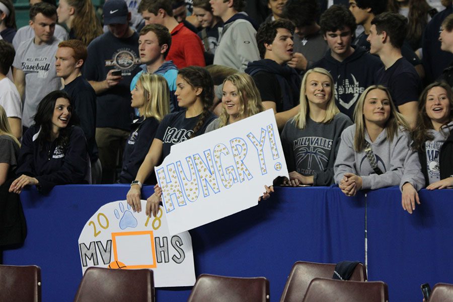 After the team scored, senior Emmy Bidnick smiles with the crowd.