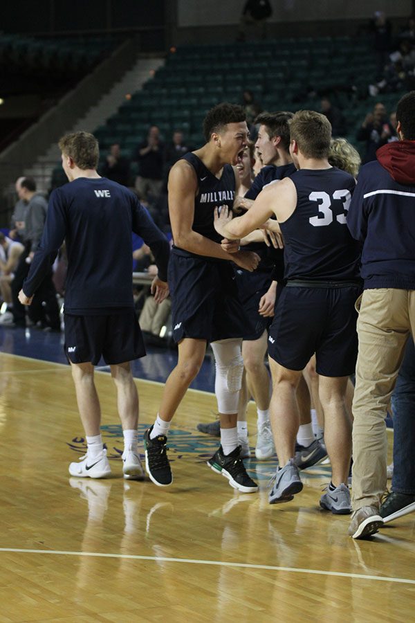 After defeating Eisenhower, junior Matty Wittenauer celebrates with the team.