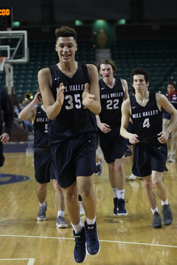 After expanding the teams lead, freshman Keeshawn Mason claps in excitement.