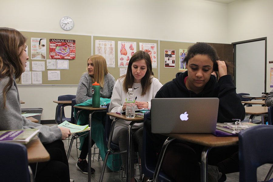 After completing their Medical Terminology lecture, junior Sydney Pullen completes her class work on Friday, Feb. 23. “I want to go into sports medicine and this class is super helpful because we get to learn the real terms that professionals in the medical field use,” Pullen said.