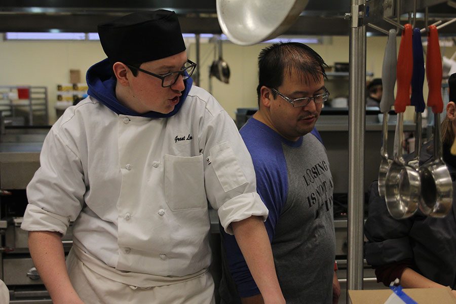 While in his Culinary Arts class at Eudora High School, junior Grant Loew asks his teacher question.  