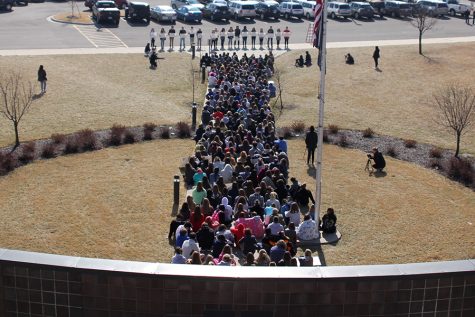Students participate in peaceful walkout to recognize victims of school shooting in Florida