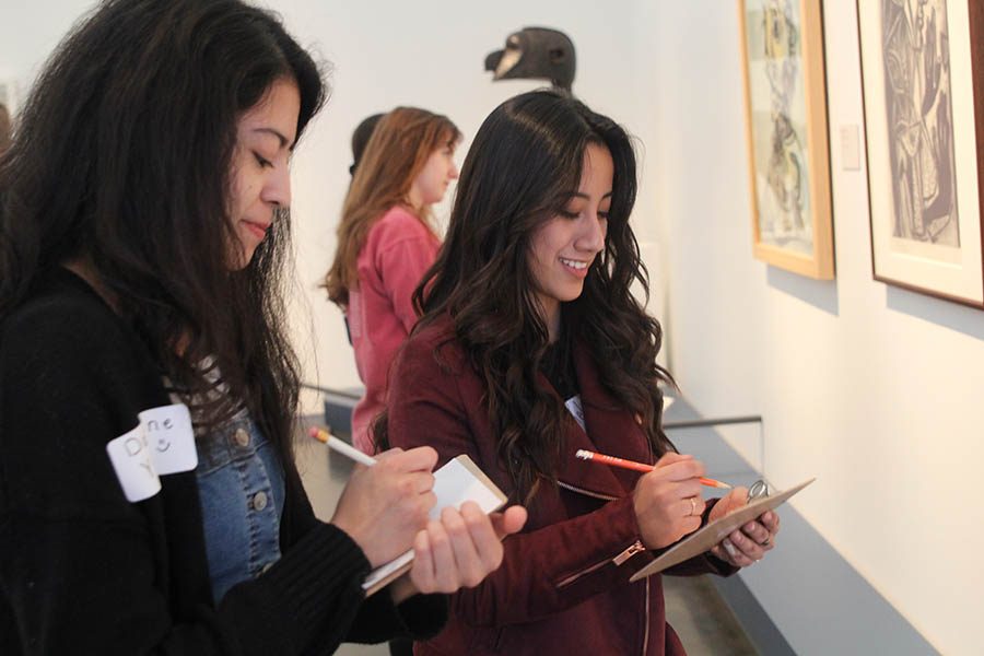 Juniors Darlene Yanez and Rojas Zurieli answer questions about the art work.