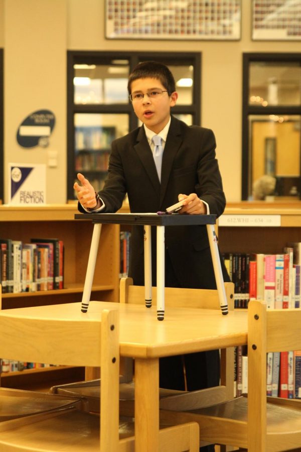 Freshman Adam White offers up his final rebuttal to the audience during the mock debate.