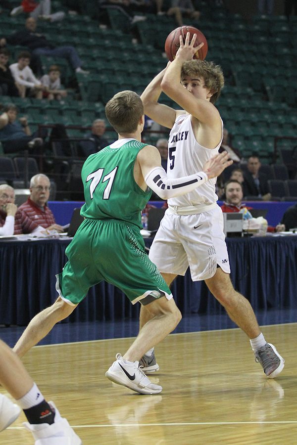 As his teammates run a play, junior Logan Talley waits for someone to get open.
