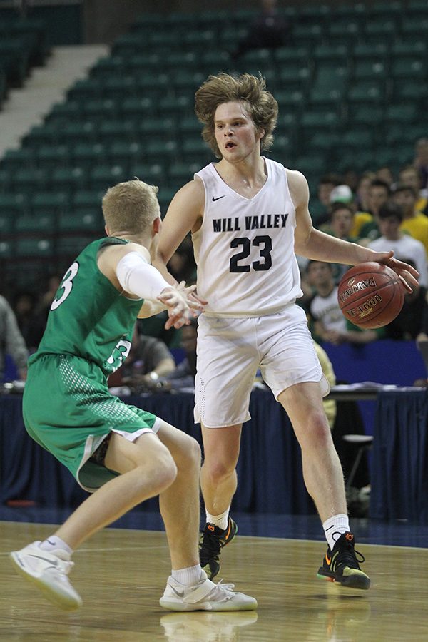 Calling a play, senior Cooper Kaifes looks for an opening to the basket. 
