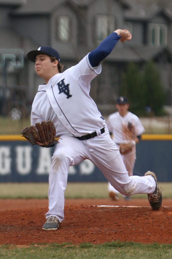 Working to keep the Jaguar lead, junior Nolan Sprague, pitches in the third inning. 