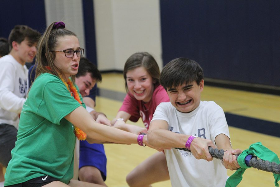 Junior Erin Miller and sophomore Carson Schwartz participate in tug of war.
