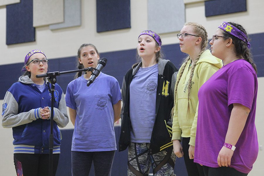 Junior Allison Shien sings in a group with her friends at open mic.