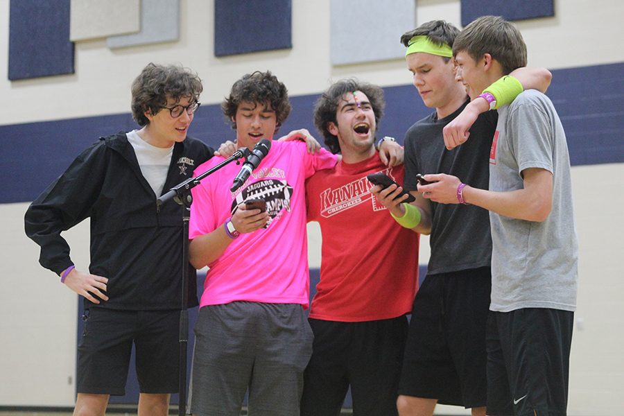 Seniors Brady Watkins, Mike Turner, Simon Stewart, Artur Chlopecki and junior Blake Aerni sing during open mic.