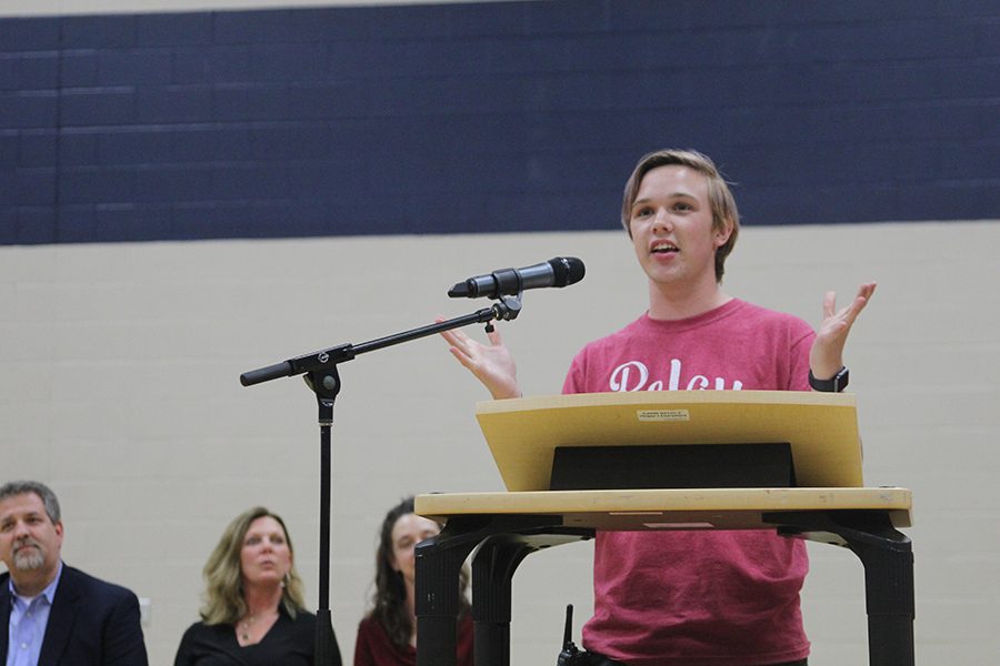 Committee chair senior Tyler Orbin opens the event.