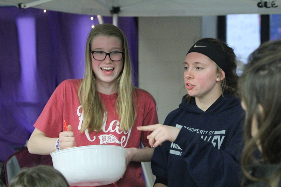 Sophomore Megan Proctor makes slime with sophomore Kylie Conner for their on-site fundraiser.