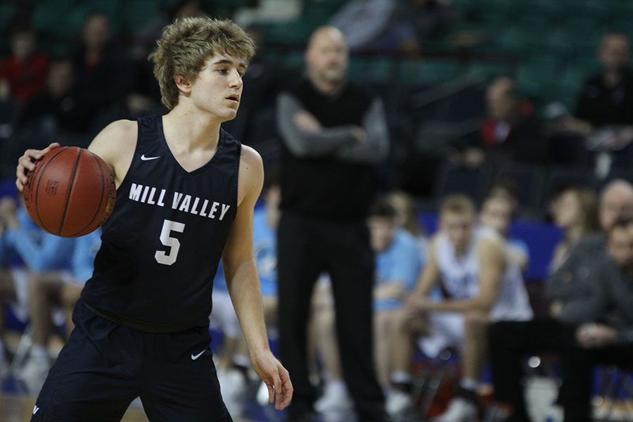 Junior Logan Talley dribbles the ball.