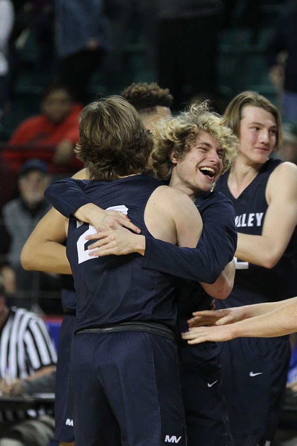 After the game, senior Colton Hinkle embraces senior Cooper Kaifes.