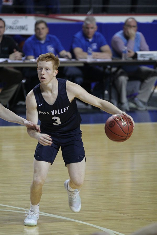 Senior Sammy Rebeck dribbles the ball.