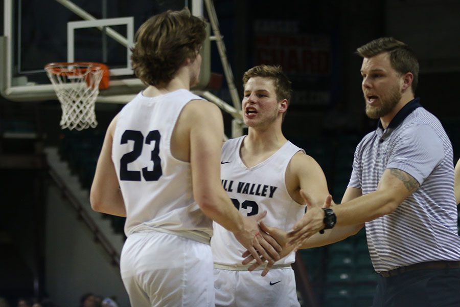 With only seconds left on the clock, senior Cooper Kaifes walks off the court after being substituted out.