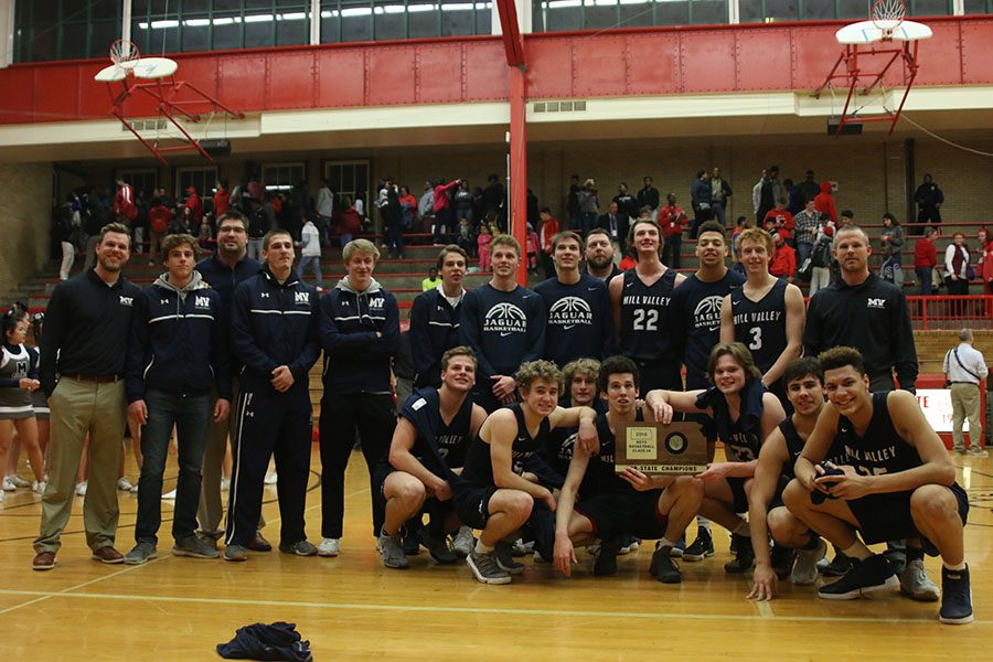 After winning against Wyandotte High School 64-63 on Friday, March 2, the team poses with the sub-state plaque.