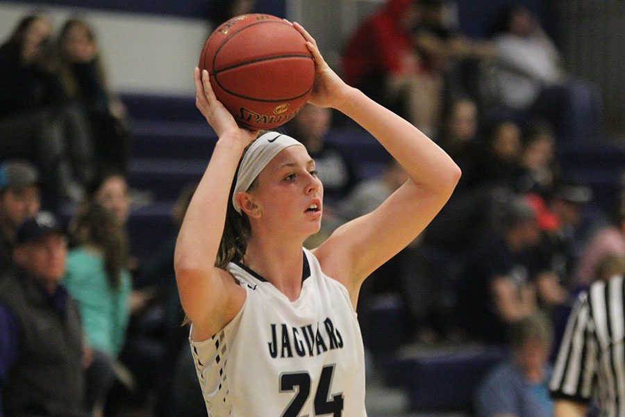 With the ball in hand, senior Evan Zars looks for other teammates to pass to. 