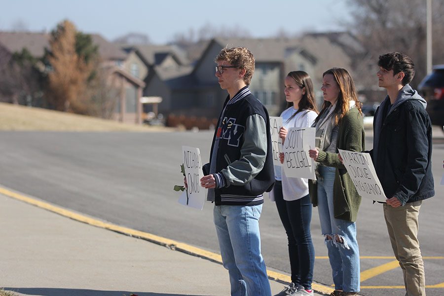 Remembering the victims, senior Carter Lawson stands in silence.