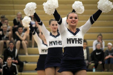 At the Miss Kansas dance competition on Saturday, Jan. 13, senior Emmy Bidnick performs in the pom routine. This routine received a polish and precision award and was also selected to be performed in the showcase for the first time in school history. 