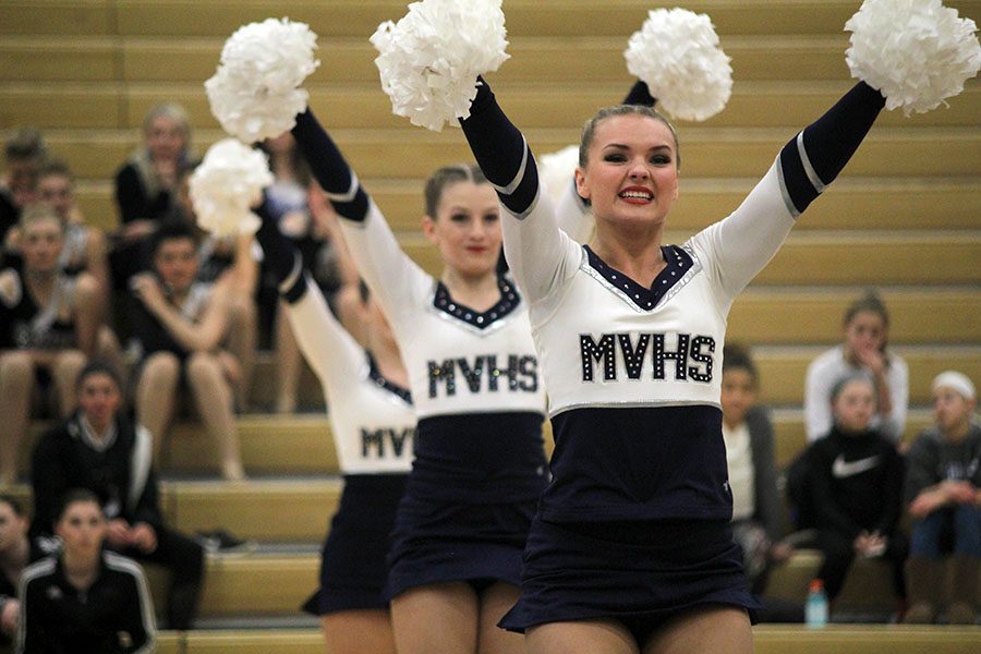 At+the+Miss+Kansas+dance+competition+on+Saturday%2C+Jan.+13%2C+senior+Emmy+Bidnick+performs+in+the+pom+routine.+This+routine+received+a+polish+and+precision+award+and+was+also+selected+to+be+performed+in+the+showcase+for+the+first+time+in+school+history.+