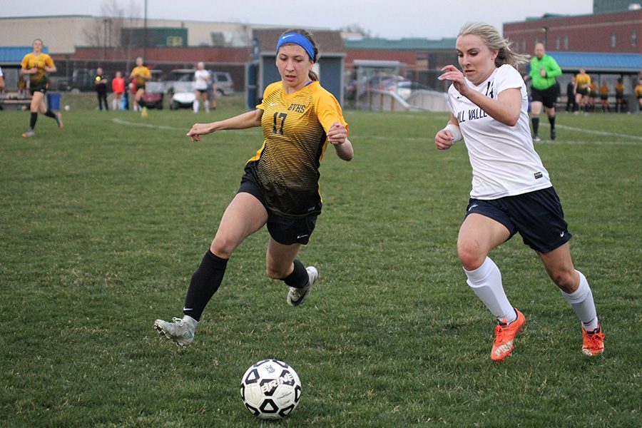 During the first half, senior Adde Hinkle runs by a defender to get the ball on Thursday, April 5.