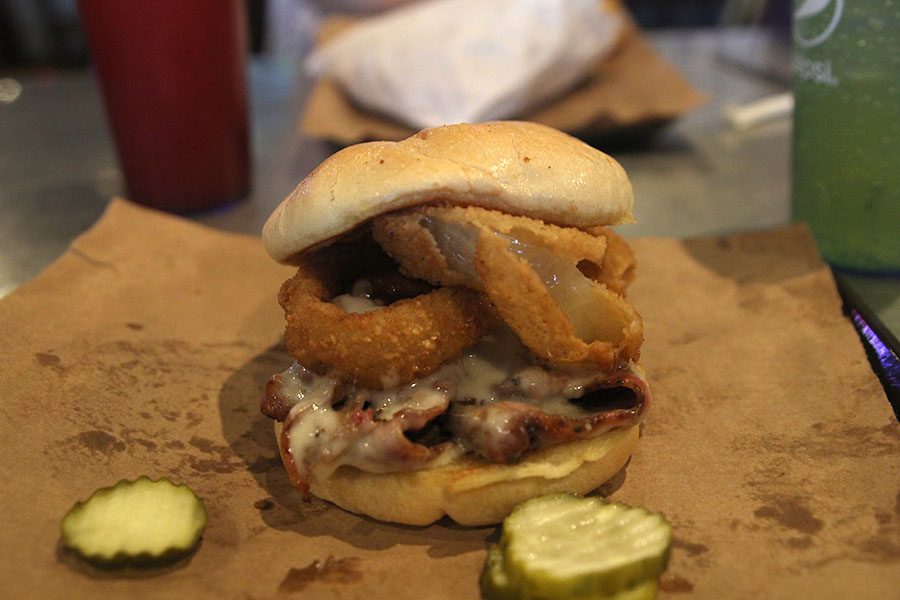 One of Joes KCs most popular sandwiches is the Z-Man, which features an onion ring on top of home cooked barbecue. 