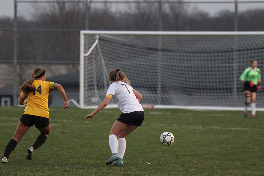 While playing defense in the second half, senior Madison Irish competes with an opponent for possession.
