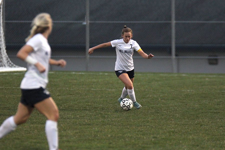 After gaining possession, senior Madison Irish looks to pass the ball to teammate Adde Hinkle.