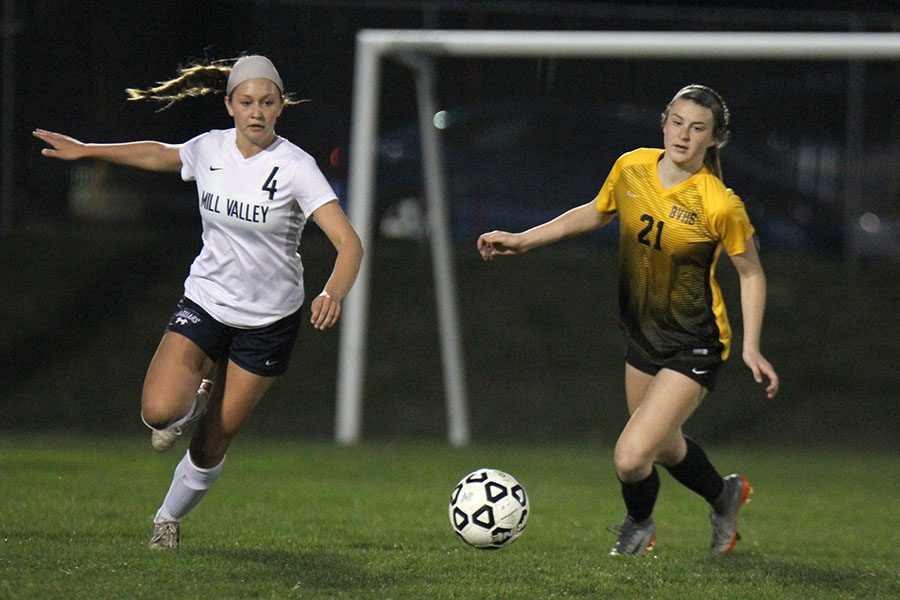 Sprinting towards the ball, sophomore Ella Shurley competes for possession.