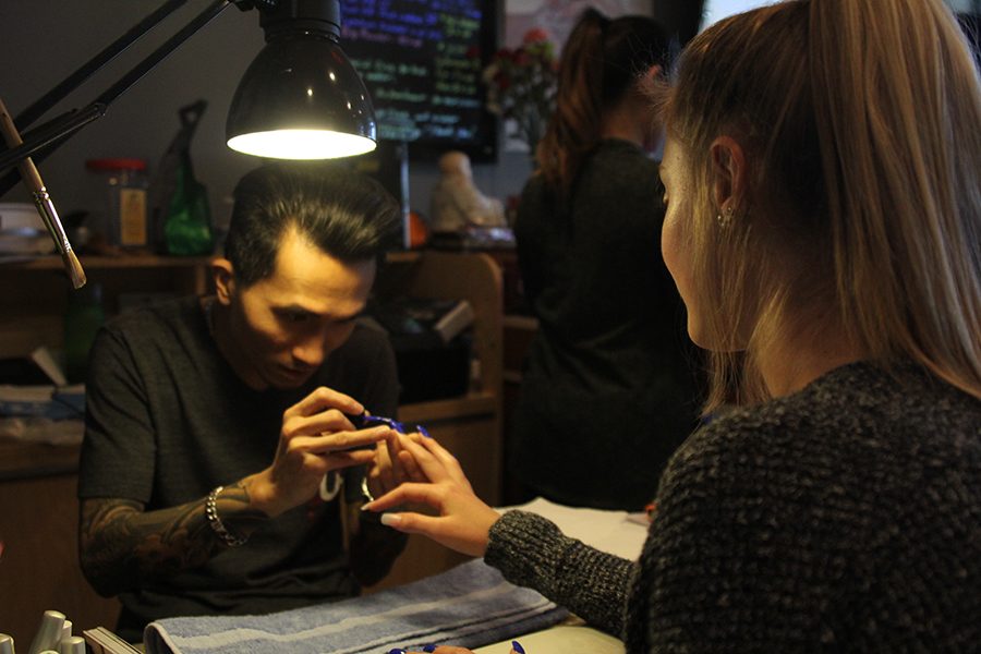 While at Nail Art, sophomore Khloe Knernschield gets her nails painted.