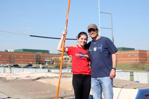 Pole vaulting serves as bonding activity between junior Abby Phillips and new coach Todd Phillips