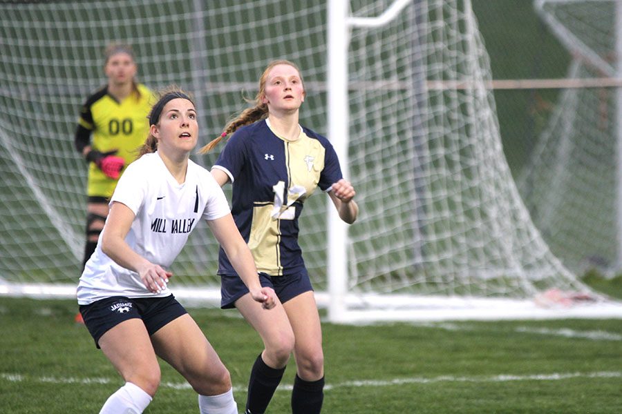 While preparing to control the ball, senior Gracie Eckardt boxes out her defender.