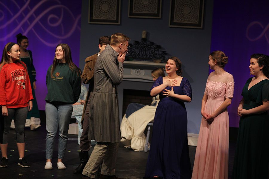 Mr. Collins, played by junior Jack Mahoney, apologizes to Mrs. Bennet, played by junior Lindsey Edwards. 