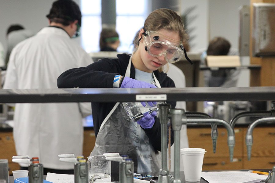 During Chemistry Lab, junior Aniston Cumbie transfers liquid. Cumbie and Thomas placed second overall. 