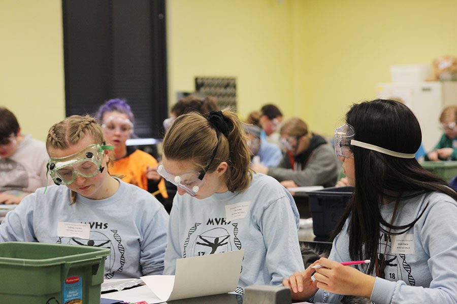 In their final event, juniors Sydney Clarkin and Liz Fraka, and freshman Hannah Chern collaborate on Experimental Design. The group placed third. 