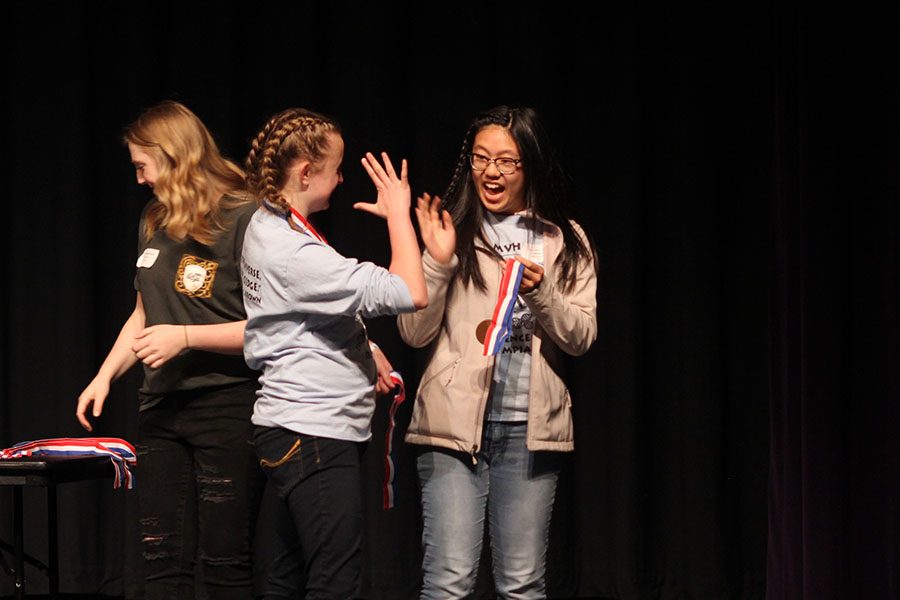 After receiving second place in Anatomy and Physiology, junior Sydney Clarkin and freshman Hannah Chern share a high five. 