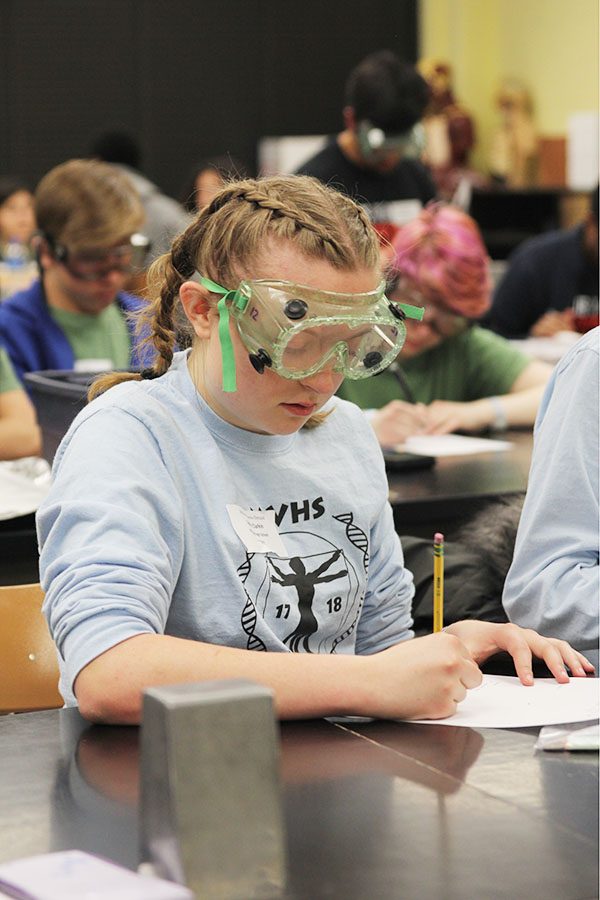 During the Experimental Design event, junior Sydney Clarkin writes a lab report. Competitors must create an experiment based on the parameters and materials given by judges in the event. 