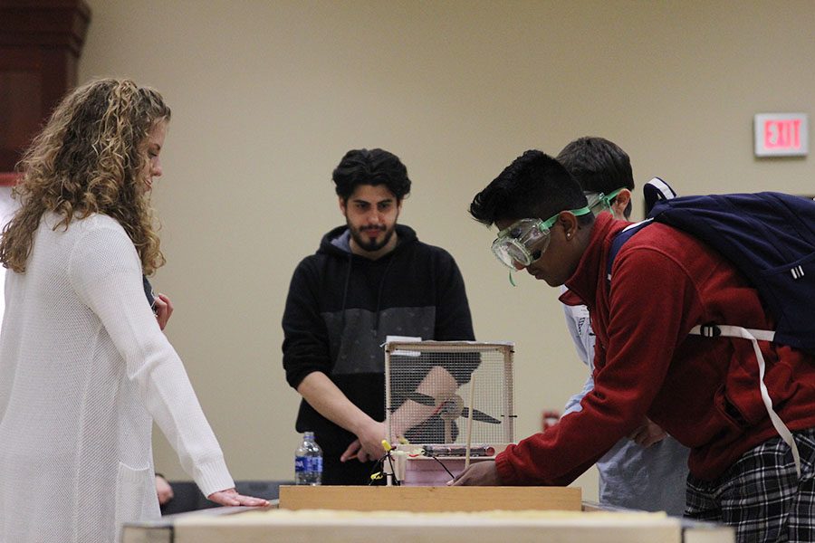 During the first trial of testing, sophomore Srikar Turaga makes an adjustment to the hovercraft. 